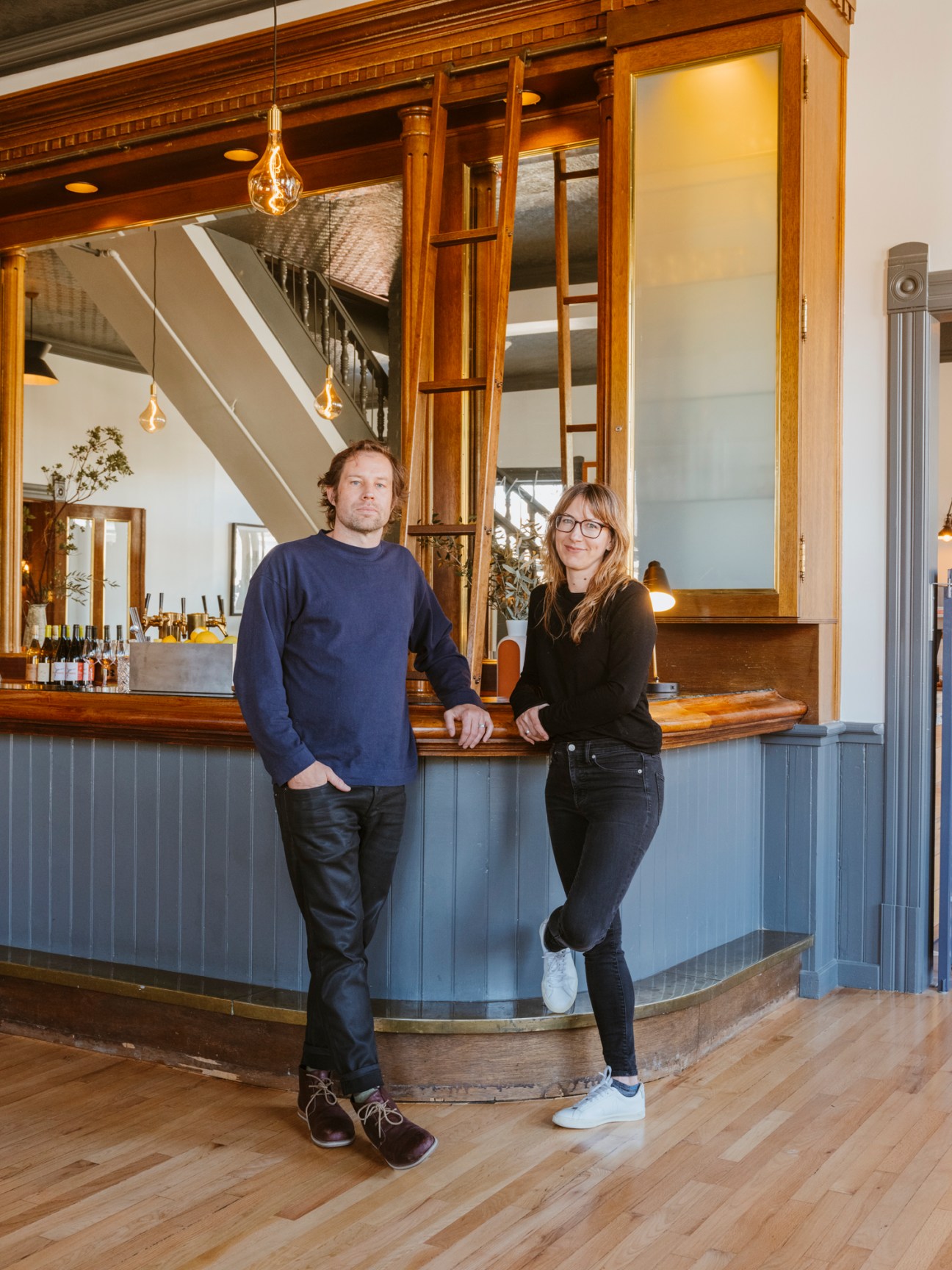 Ian Read and Gretchen Krebs, founders of architectural interiors firm Medium Plenty, standing at hotel bar