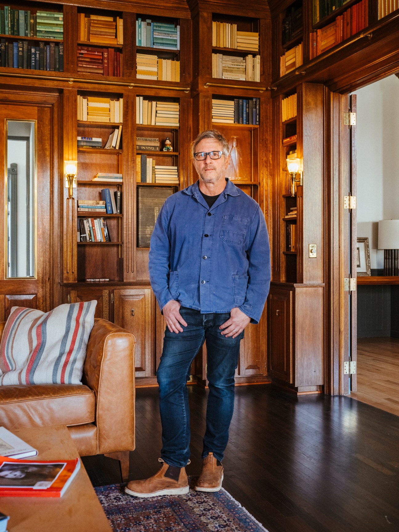 Mark Rogero standing in the mahogany-lined library of The Thatcher Hotel