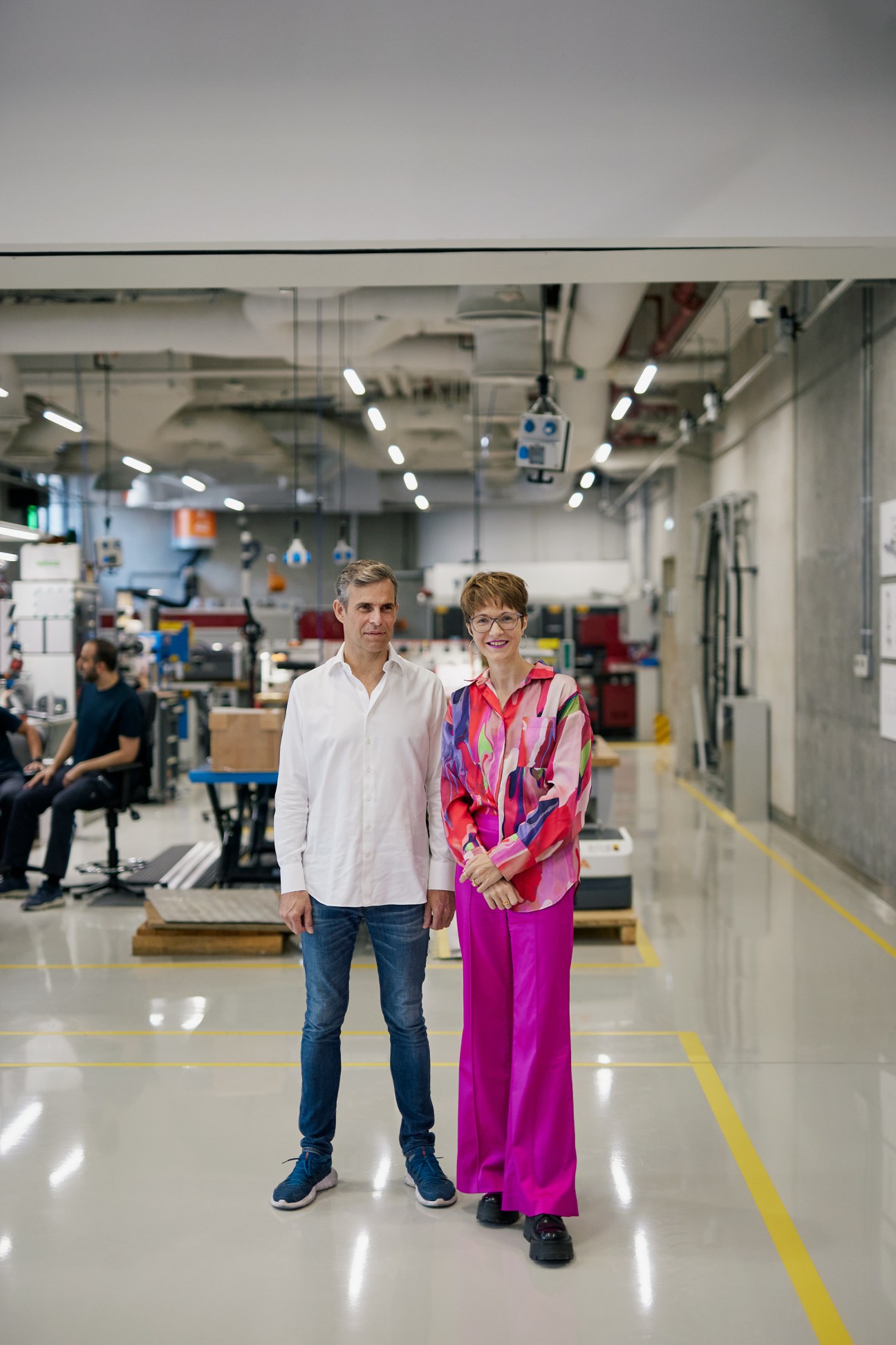 Lin Kayser and Josefine Lissner stand in a modern industrial workshop at Dubai Future Labs