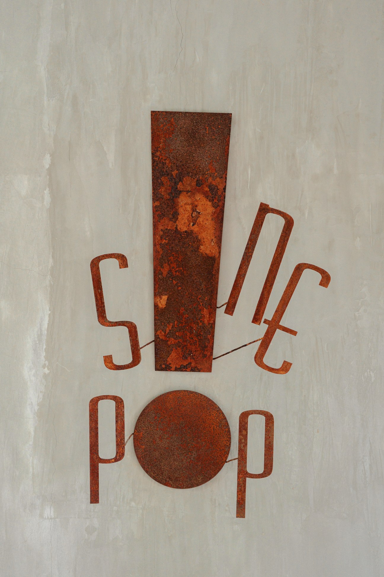 Rusty red letterforms spelling SINE POP with weathered metal texture against light background