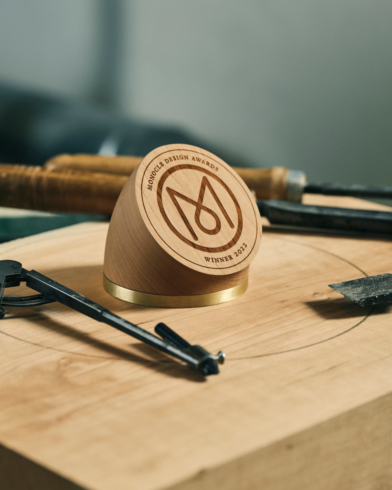 Monocle Design Award trophy made from cherry wood and brass designed by Harry Thaler
