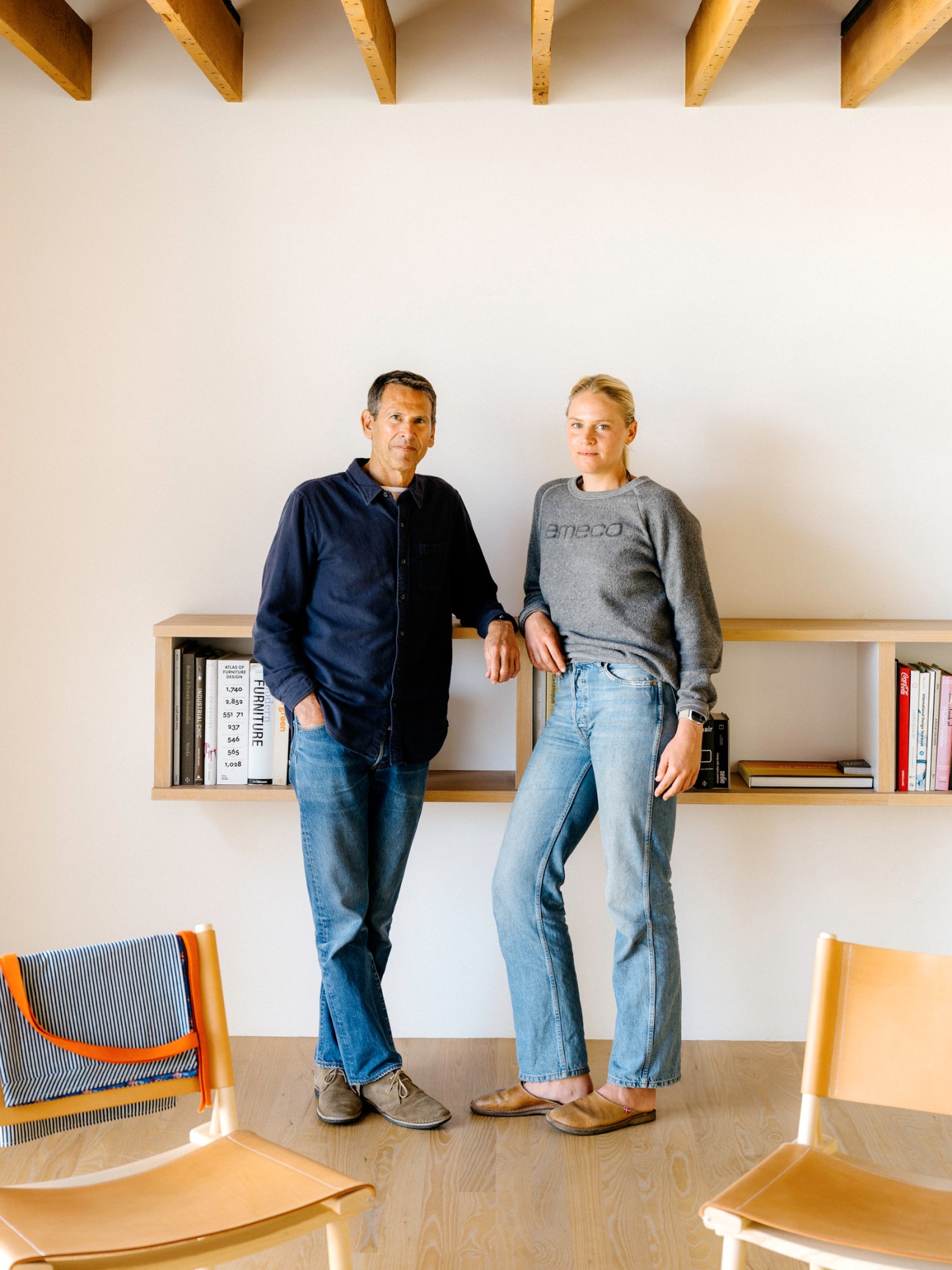 Sam Hecht and Kim Colin of Industrial Facility standing in their design studio with exposed ceiling beams