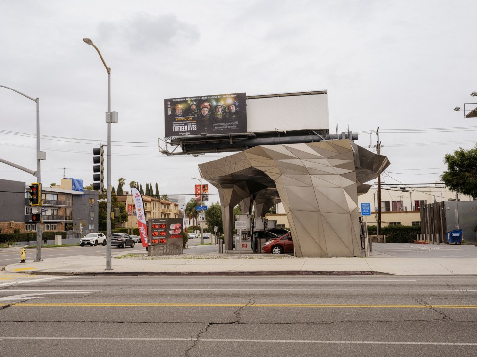 Modern angular geometric gas station canopy with car underneath in Los Angeles