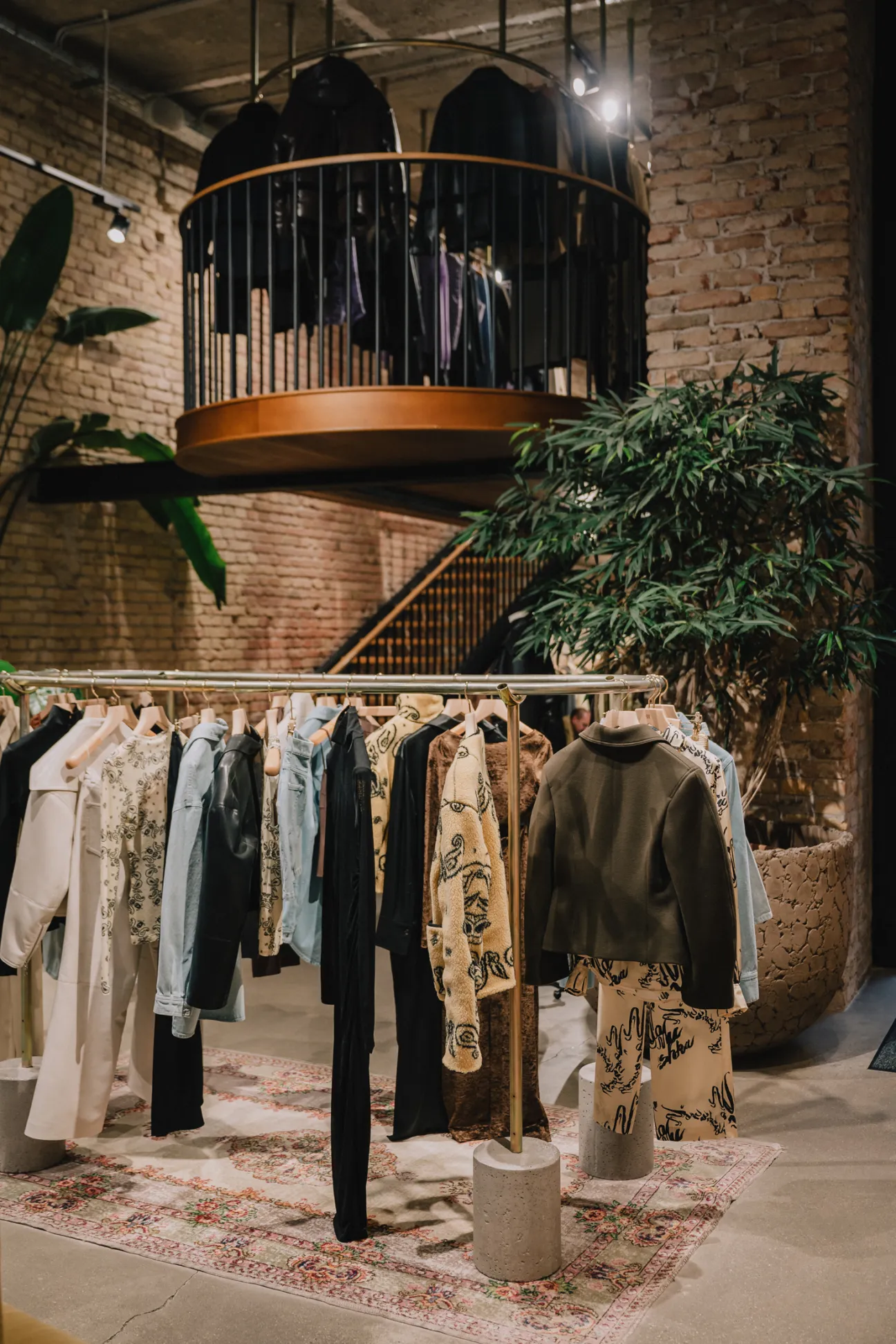 Interior of Nanushka flagship store showing oversized silhouettes and contemporary fashion