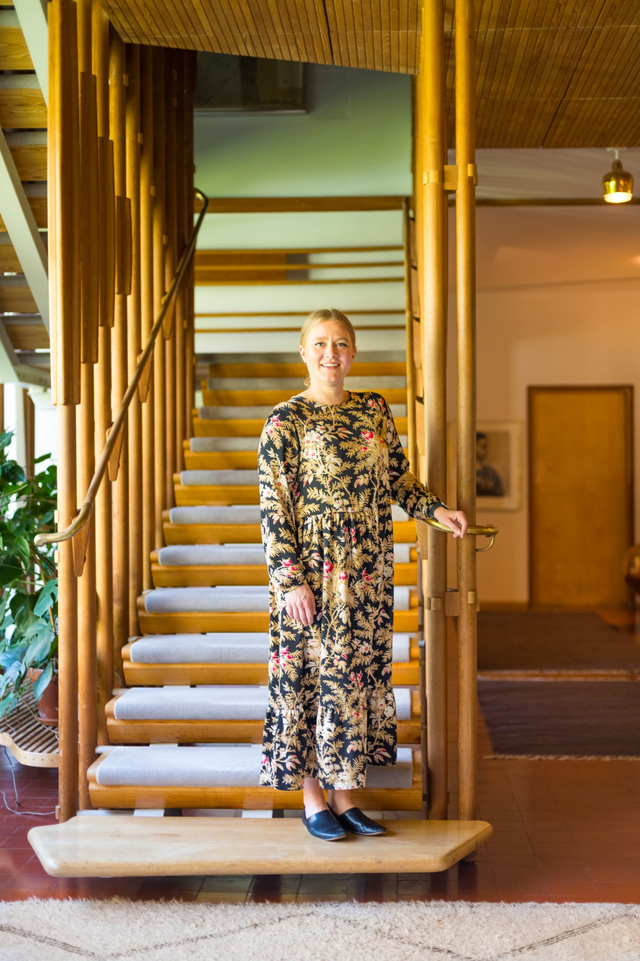 Portrait of Saida Lindroos standing inside Villa Mairea