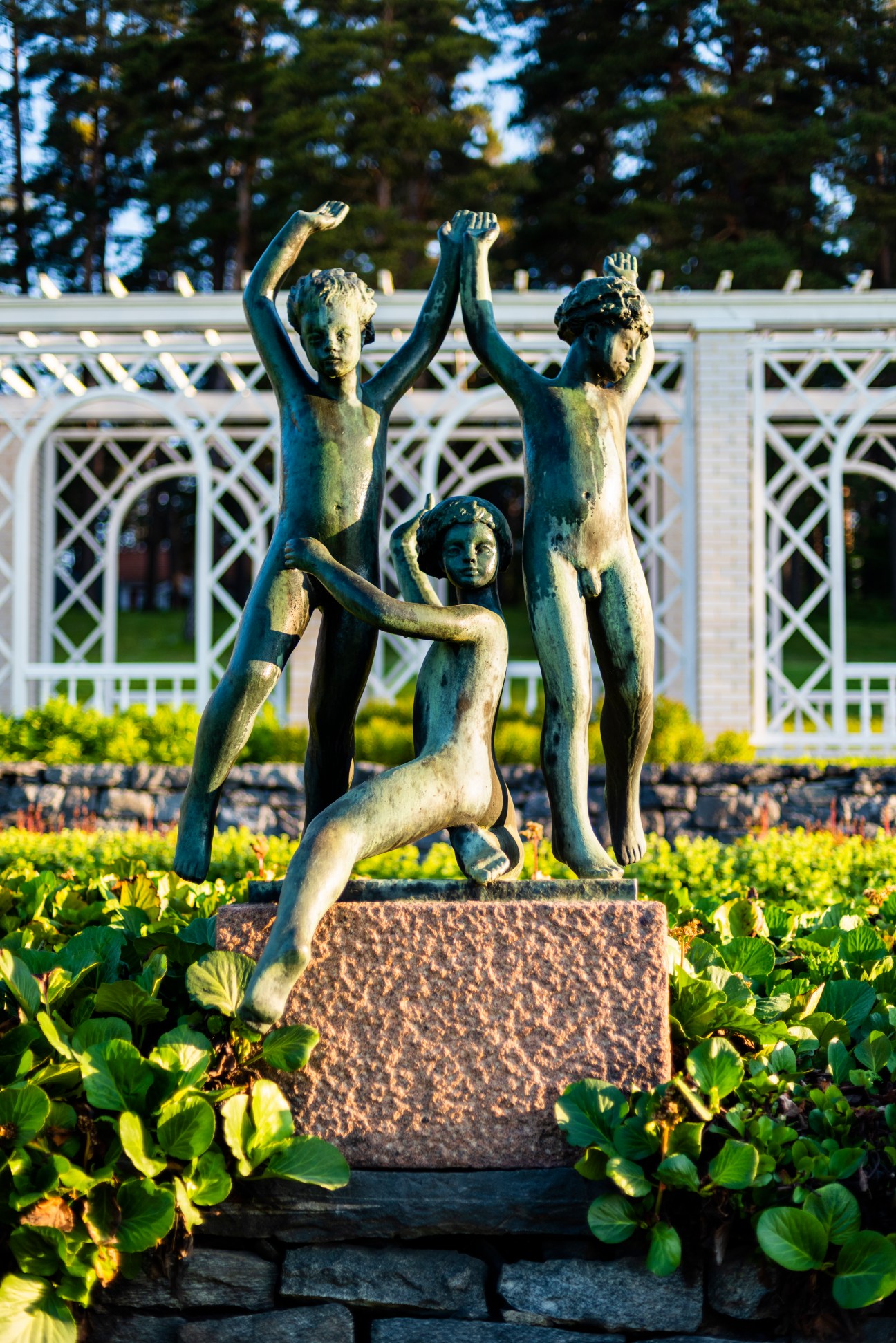 Sculpture titled Playing Children by Finnish sculptor Carl Wilhelms displayed outdoors