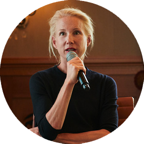 Nora Fehlbaum, CEO of Vitra, speaking at a microphone during The Chiefs conference.