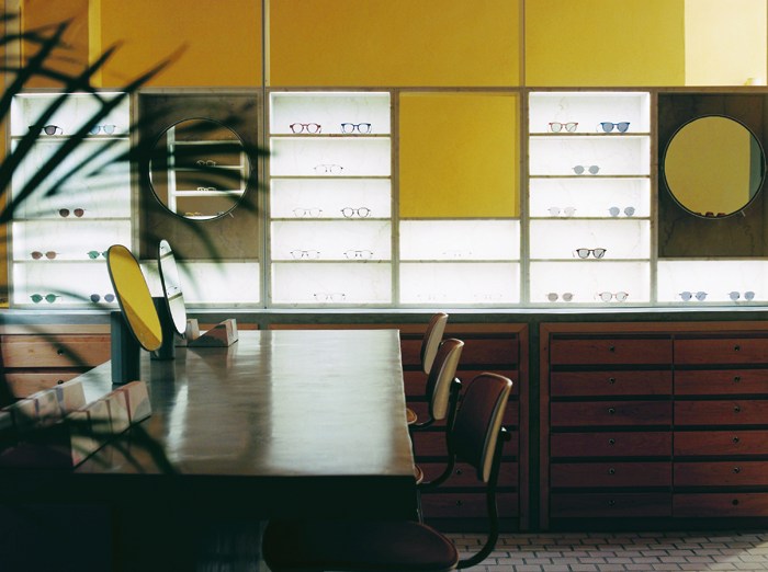 Interior of Glassworks optician in Tel Aviv showing modular display system with eyewear and modern furniture
