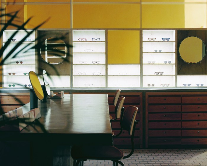 Interior of Glassworks optician in Tel Aviv showing modular display system with eyewear and modern furniture