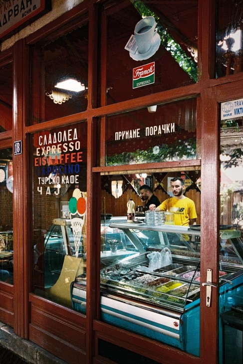 People enjoying coffee at a traditional café in Skopje's Old Bazaar