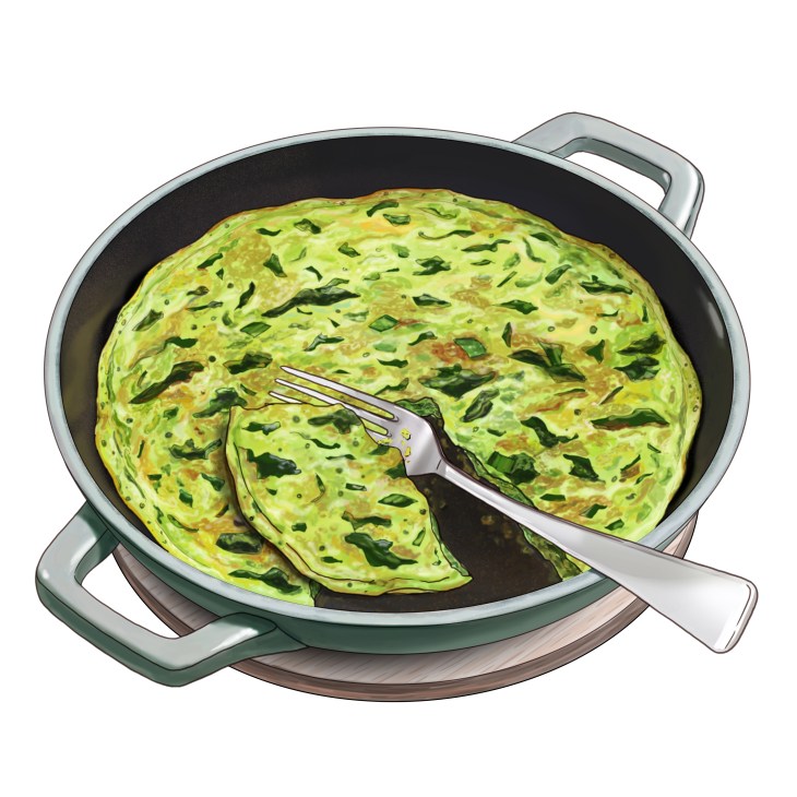 Green Persian omelette with spinach and dill being lifted from a black pan with a fork