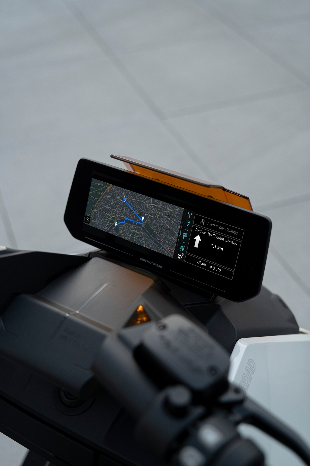 BMW Motorrad CE 04 digital display showing navigation map on handlebars.