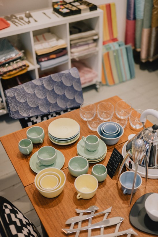 Interior of Palmetta Design showing textiles, homeware and Alessi kitchenware