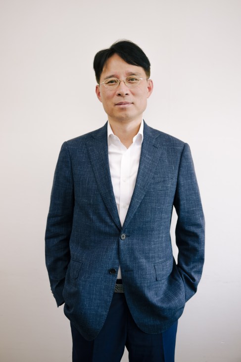 Jung-Youl Park, director of the Korean Culture and Information Service, wearing a blue blazer and glasses.