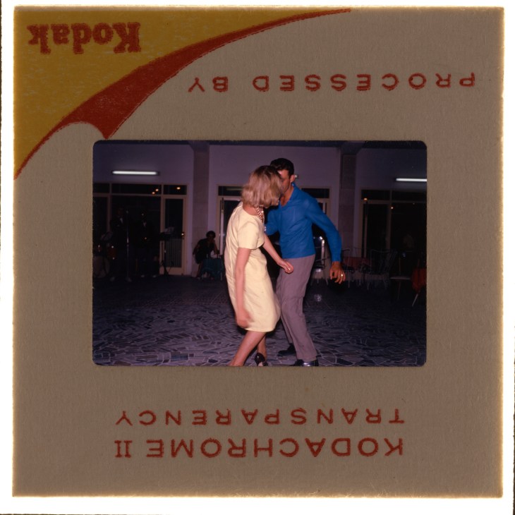 Kodak slide showing couple dancing at evening social event in mid-century interior setting