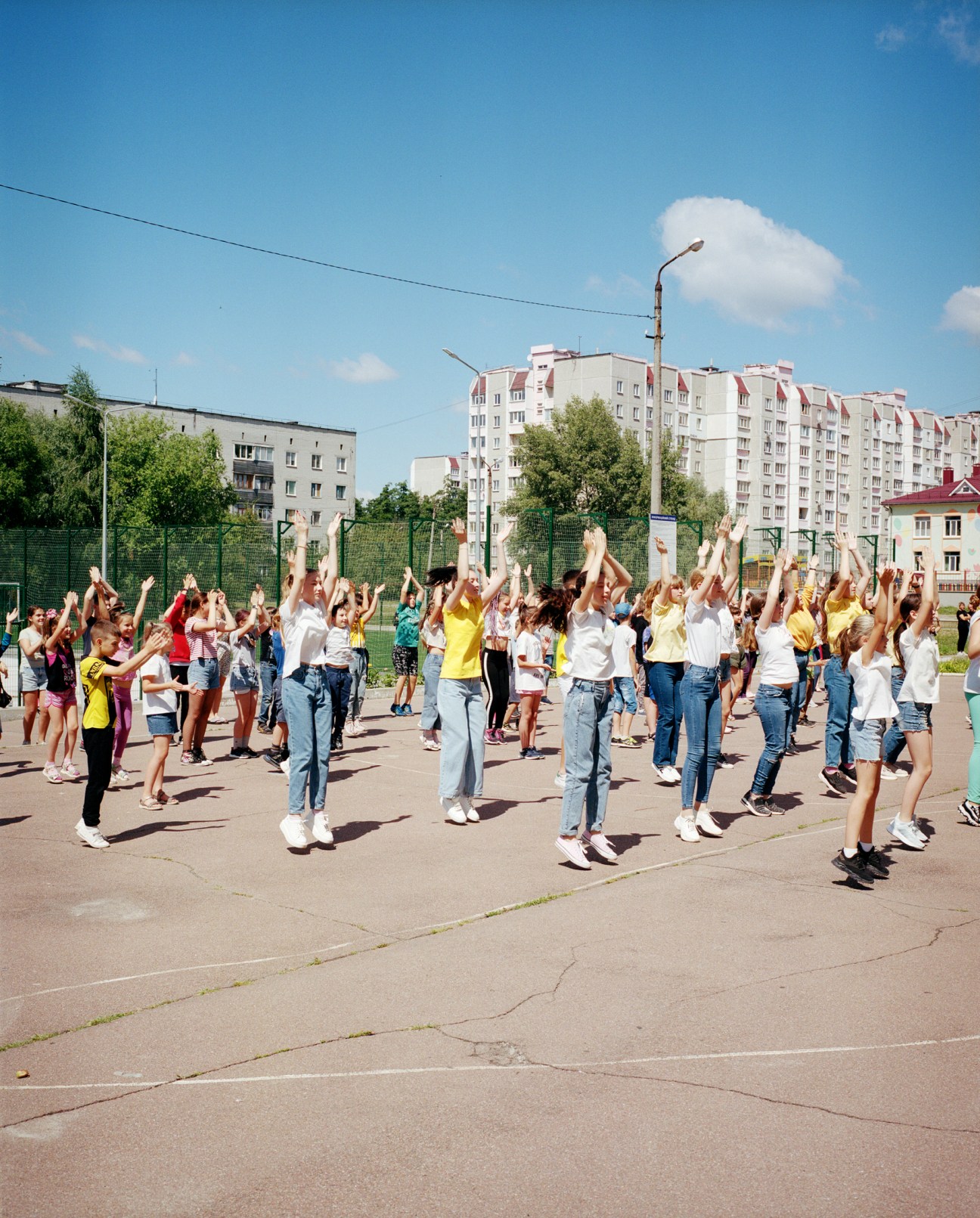 Children at school #35 dance to celebrate summer in their classroom