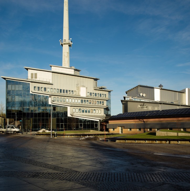Modern curved glass building exterior with geometric architectural design