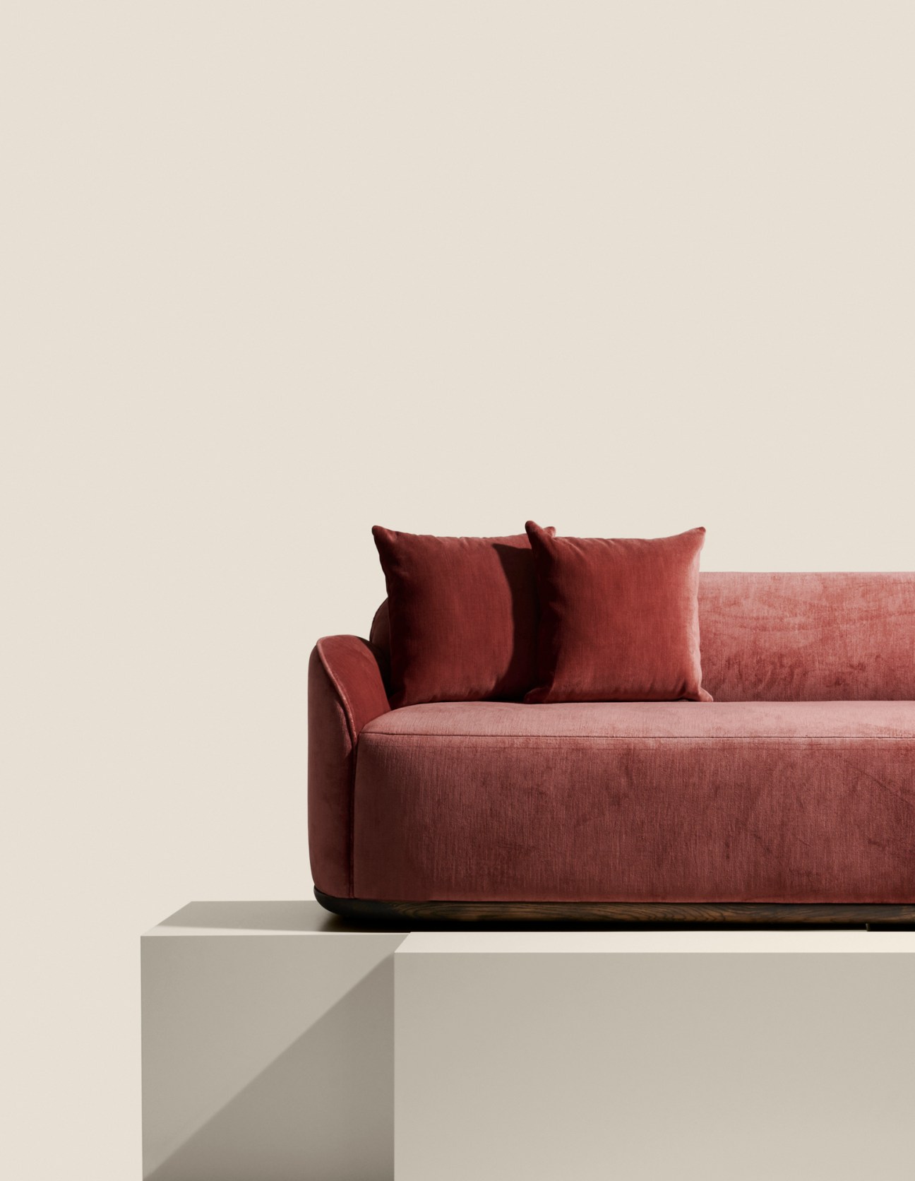 Poiat Unio Collection sofa in warm timber and soft furnishings showcasing Finnish craftsmanship