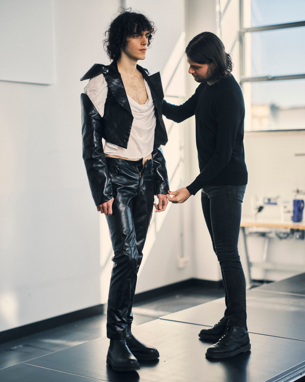 Model Alessio Bargiacchi posing with student designer Federico Toscano in a bright studio space