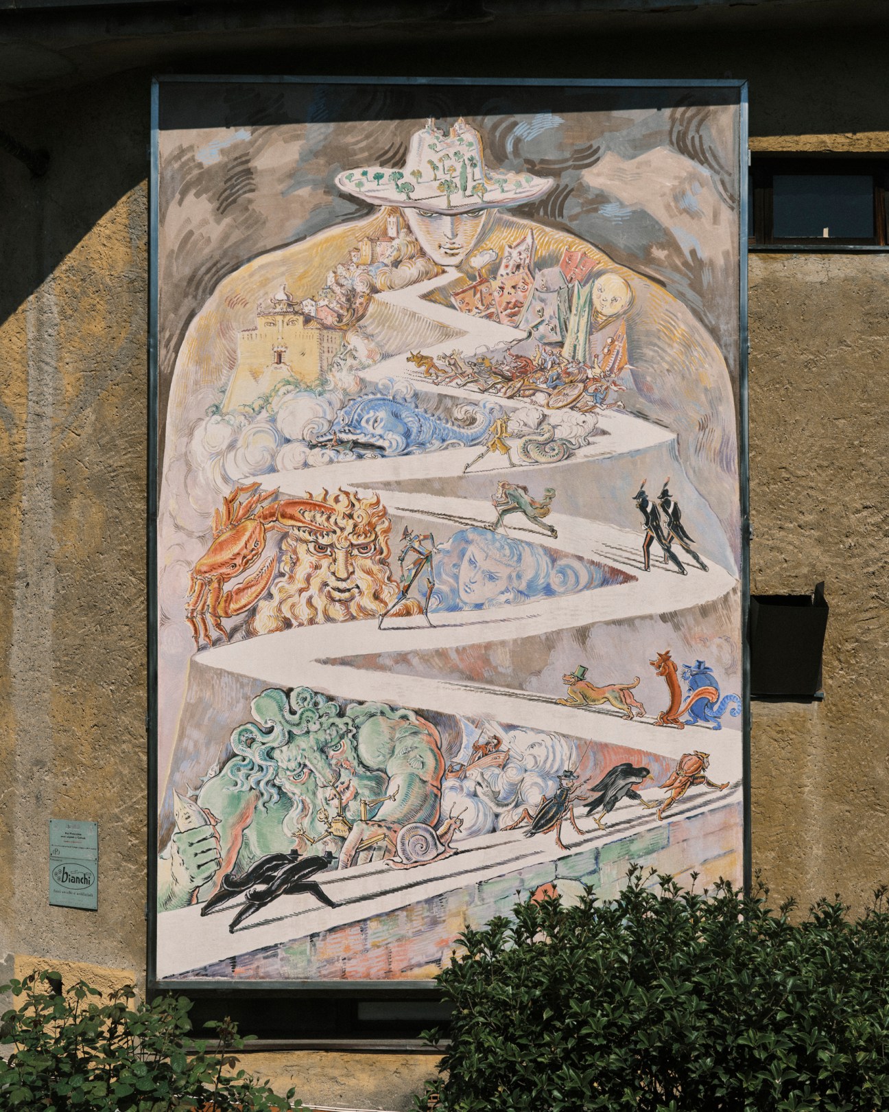 Colorful illustrated panels depicting scenes from Pinocchio story integrated into landscape design at Parco di Pinocchio