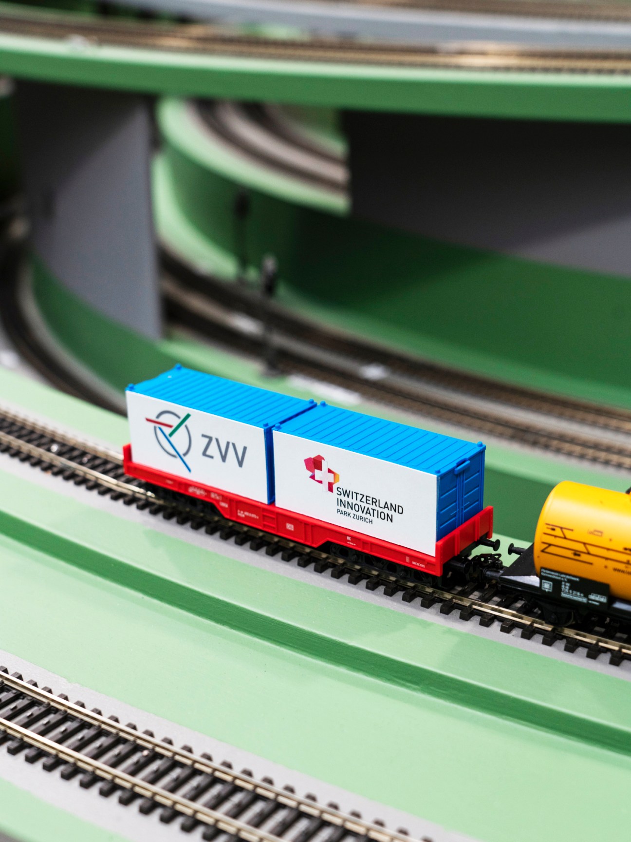 Model cargo trains on railway tracks in the laboratory simulation setup