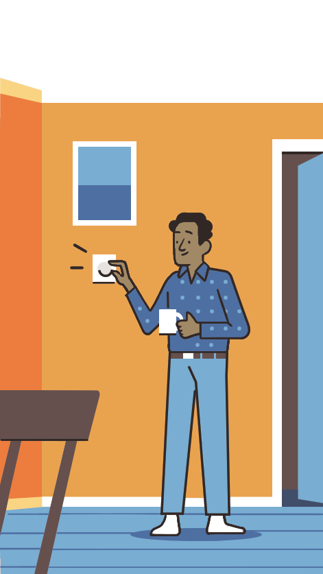 Man in blue sweater holding coffee cup and adjusting wall-mounted dimmer switch in orange room