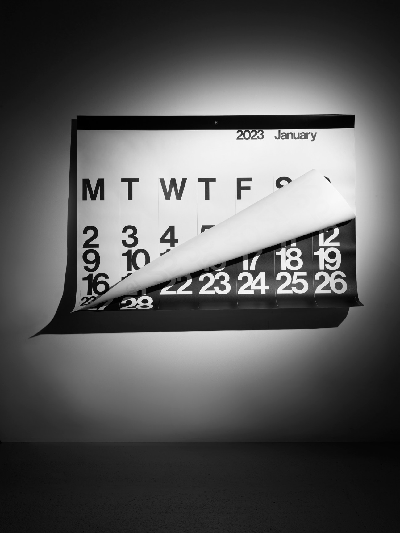 Wall calendar with pages being peeled back revealing months underneath