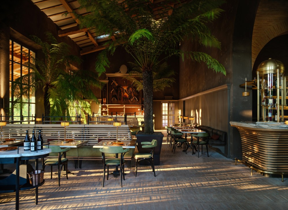 Restaurant interior with tropical plants, wooden ceiling beams, dining tables and curved bar area