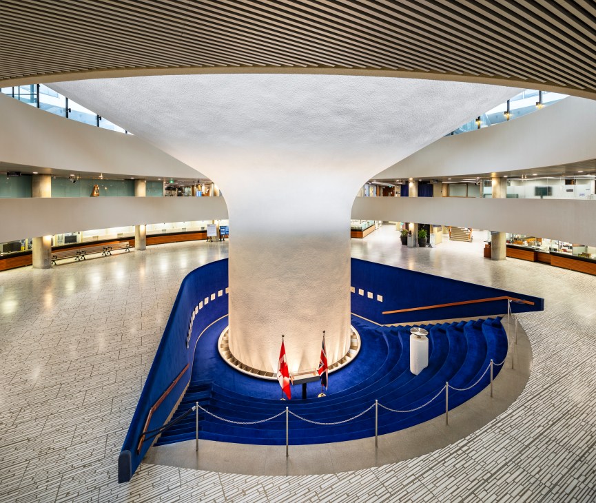 Interior view of Toronto City Hall's Rotunda and Hall of Memory showing curved modernist architecture with multi-level balconies