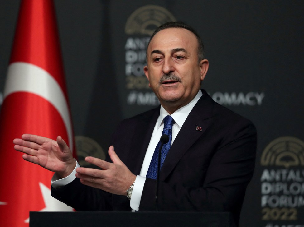 Turkish Foreign Minister Mevlut Cavusoglu speaking with hand gestures at the Antalya Diplomacy Forum