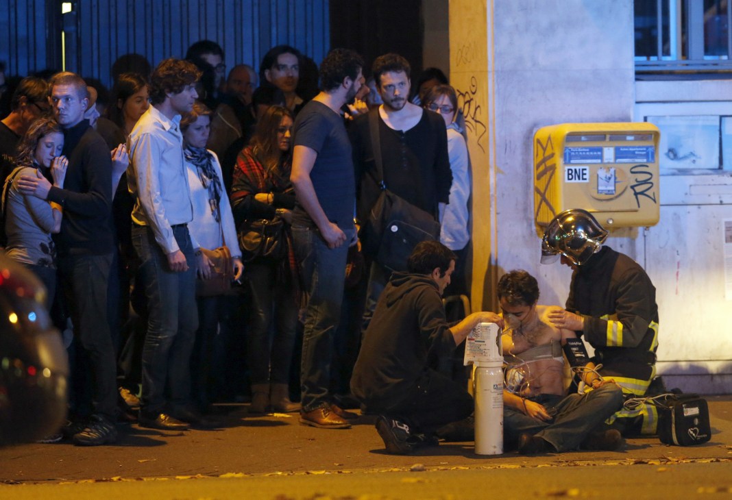 Injured man being assisted near the Bataclan concert hall during the attack
