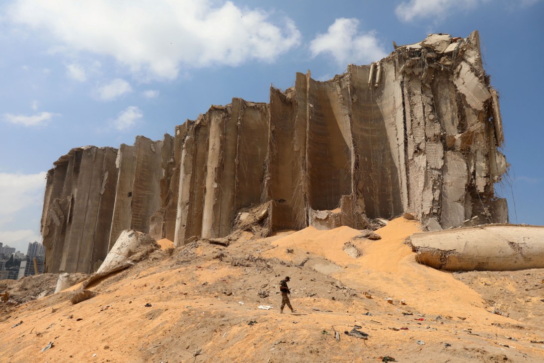 Massive destroyed concrete structure with vertical walls and debris at Beirut port after August 2020 explosion