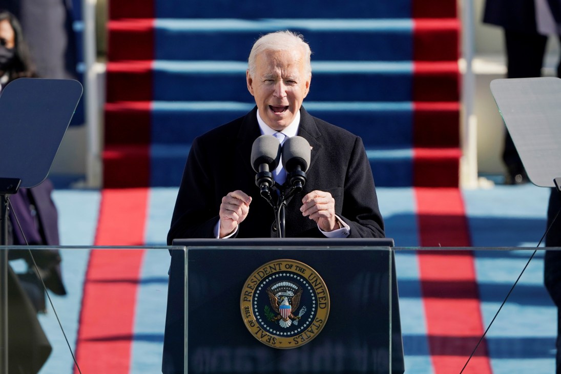 Biden delivering his inauguration address to a socially distanced crowd
