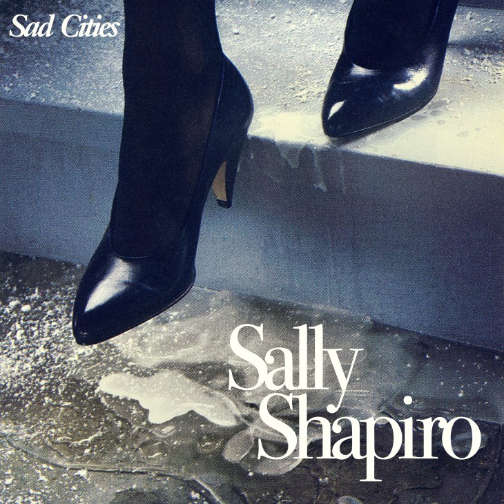 Album cover showing black high-heeled shoes walking on wet pavement with 'Sad Cities' and 'Sally Shapiro' text