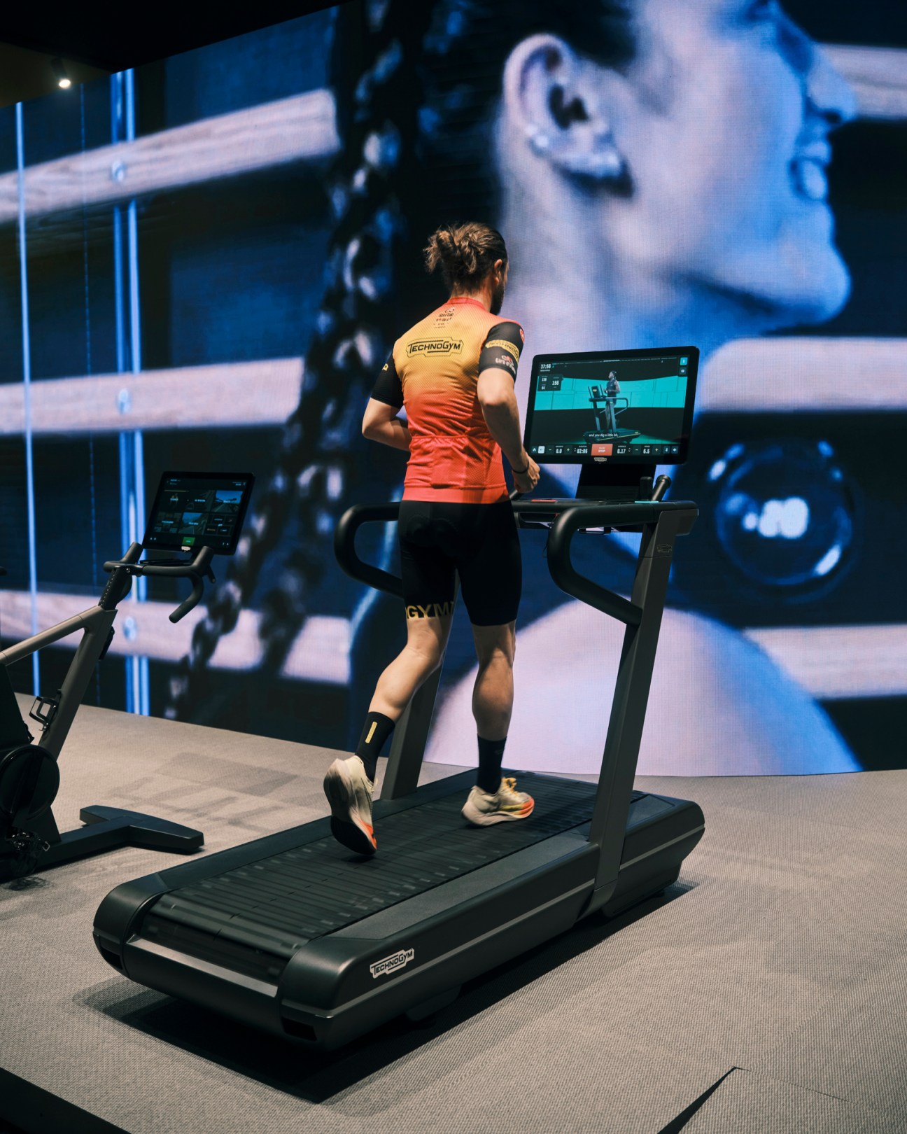 Run treadmill by Technogym being demonstrated by professional runners at Salone