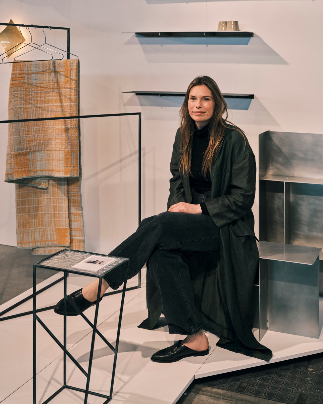 Steel and glass magazine racks and shelves by Esther de Vos displayed at Salone Satellite