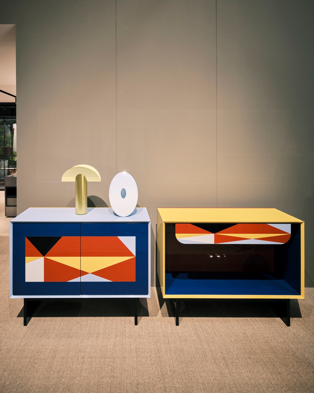 Linea cabinets by Alessandro Mendini for Porro with colorful geometric pattern doors and black legs