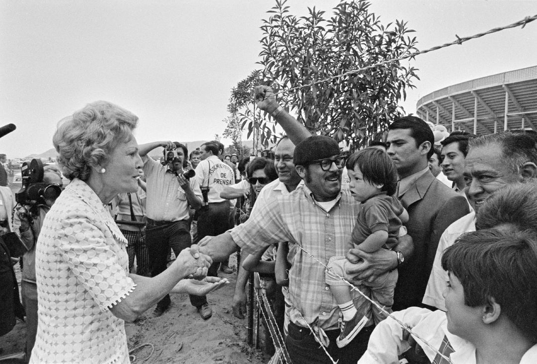 Pat Nixon shaking hands with crowd at Friendship Park border opening in 1971
