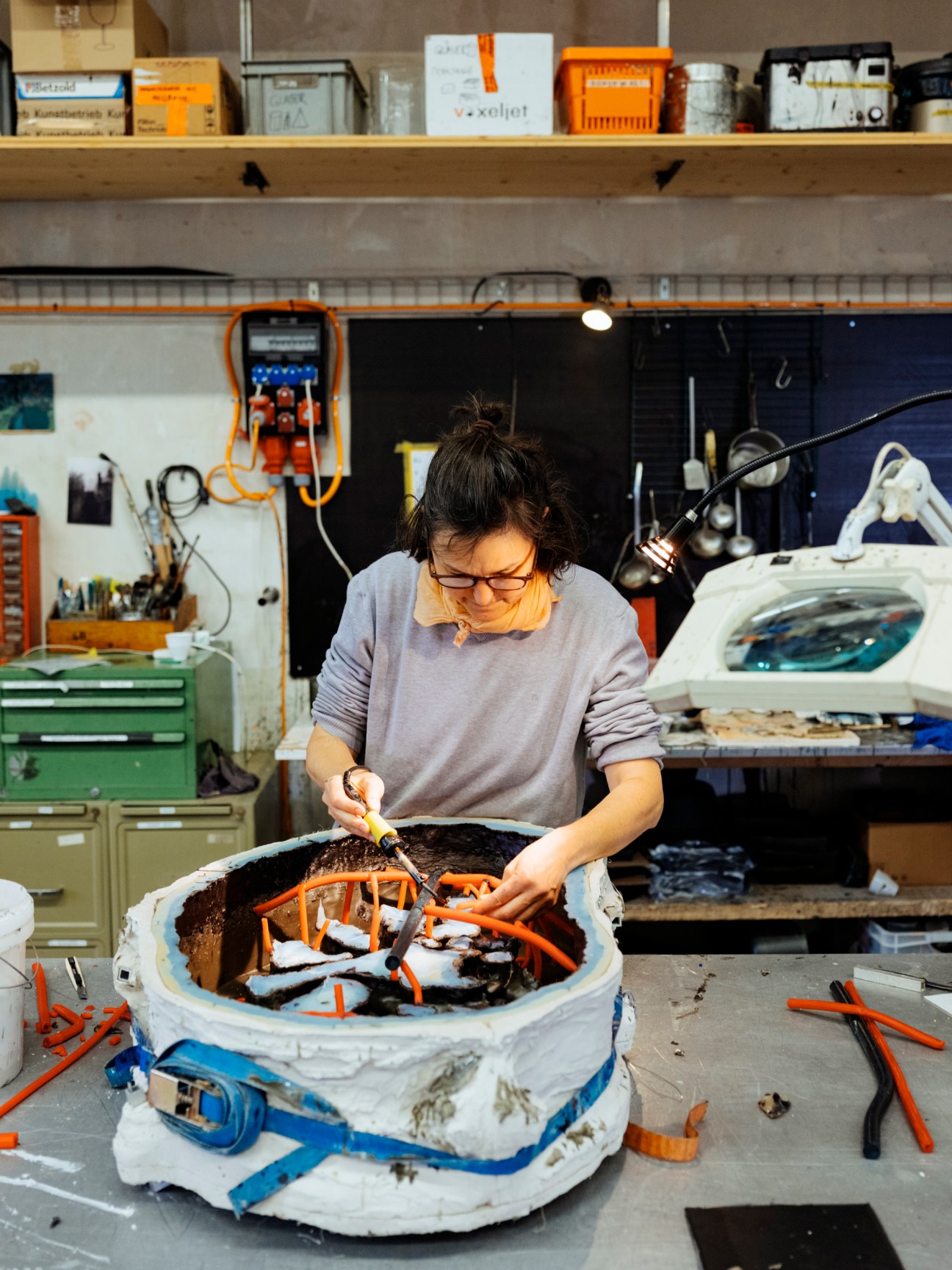 An engineer inspecting a steel object.