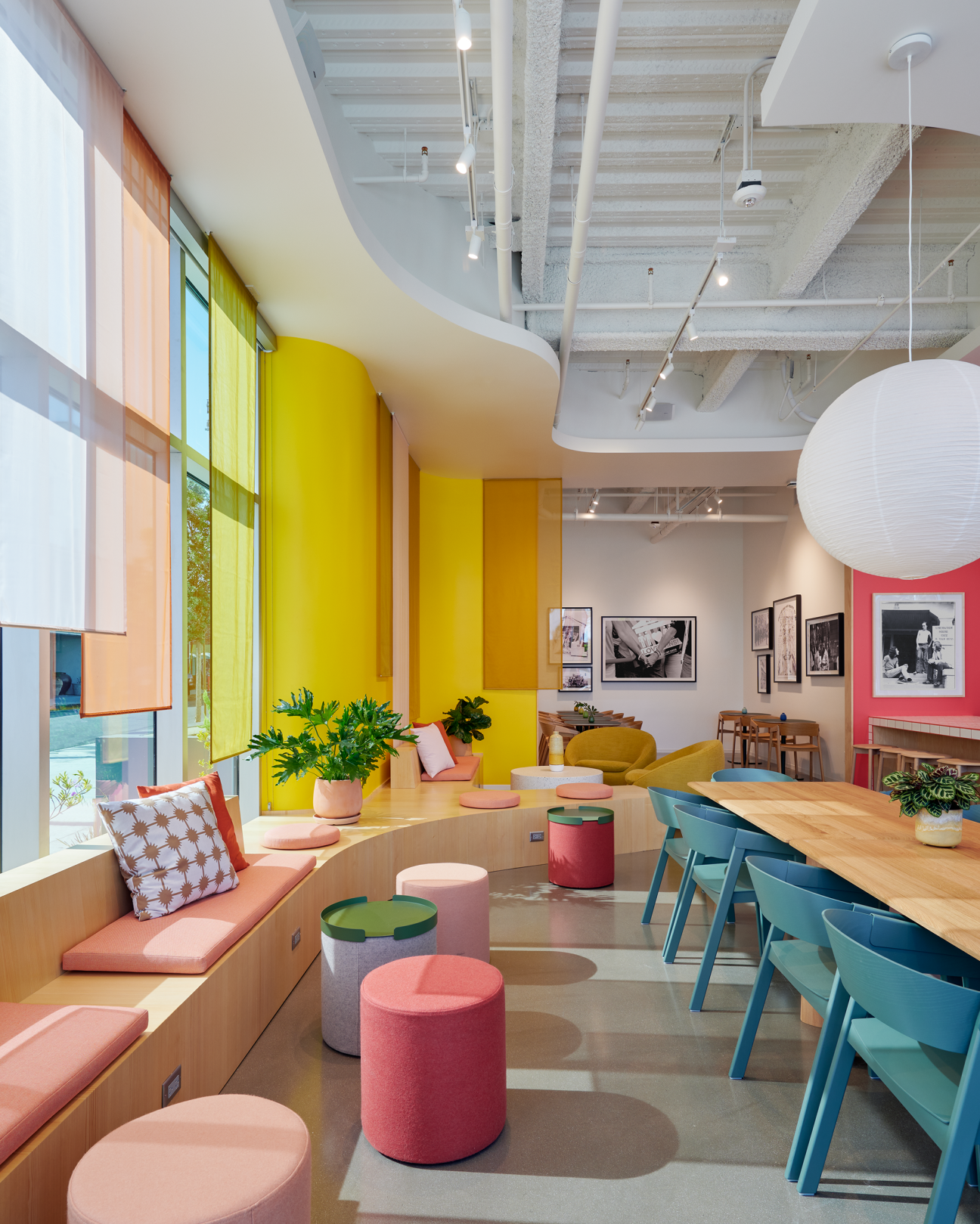 Bright coloured interior of a restaurant with stools and tables