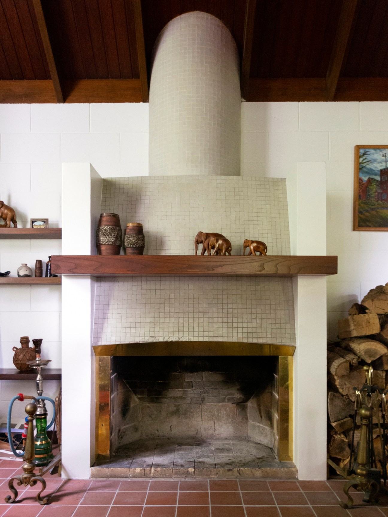 The sculptural tiled fireplace