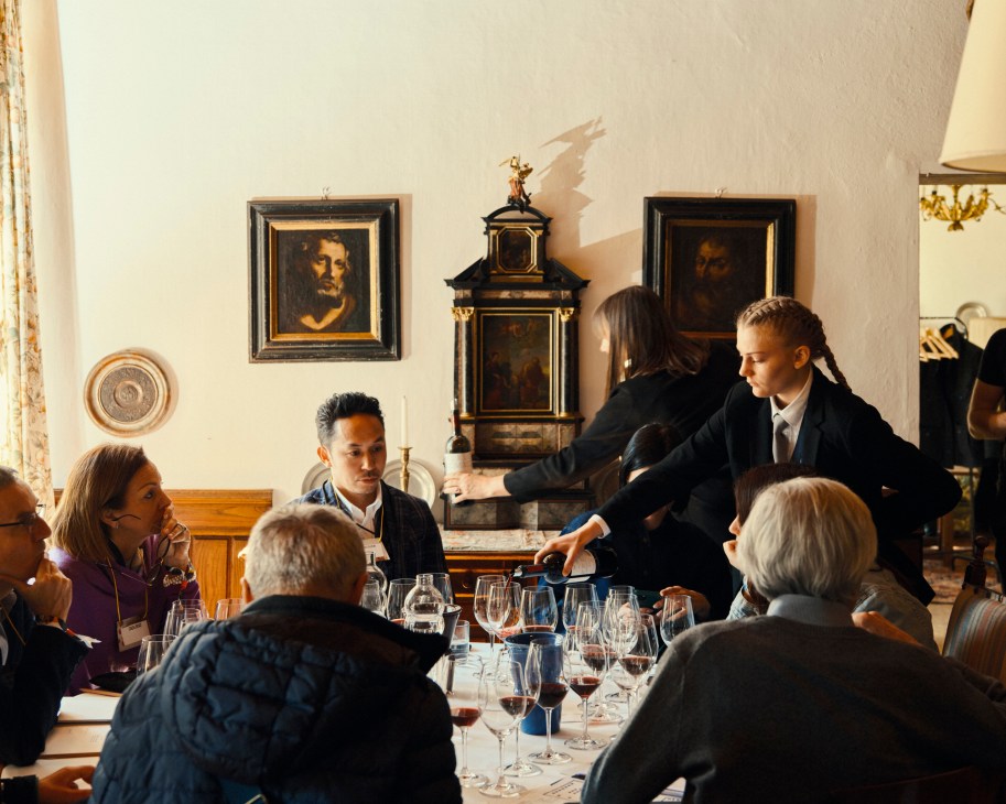 Wine tasting session with multiple glasses of Lageder vintages arranged on a table