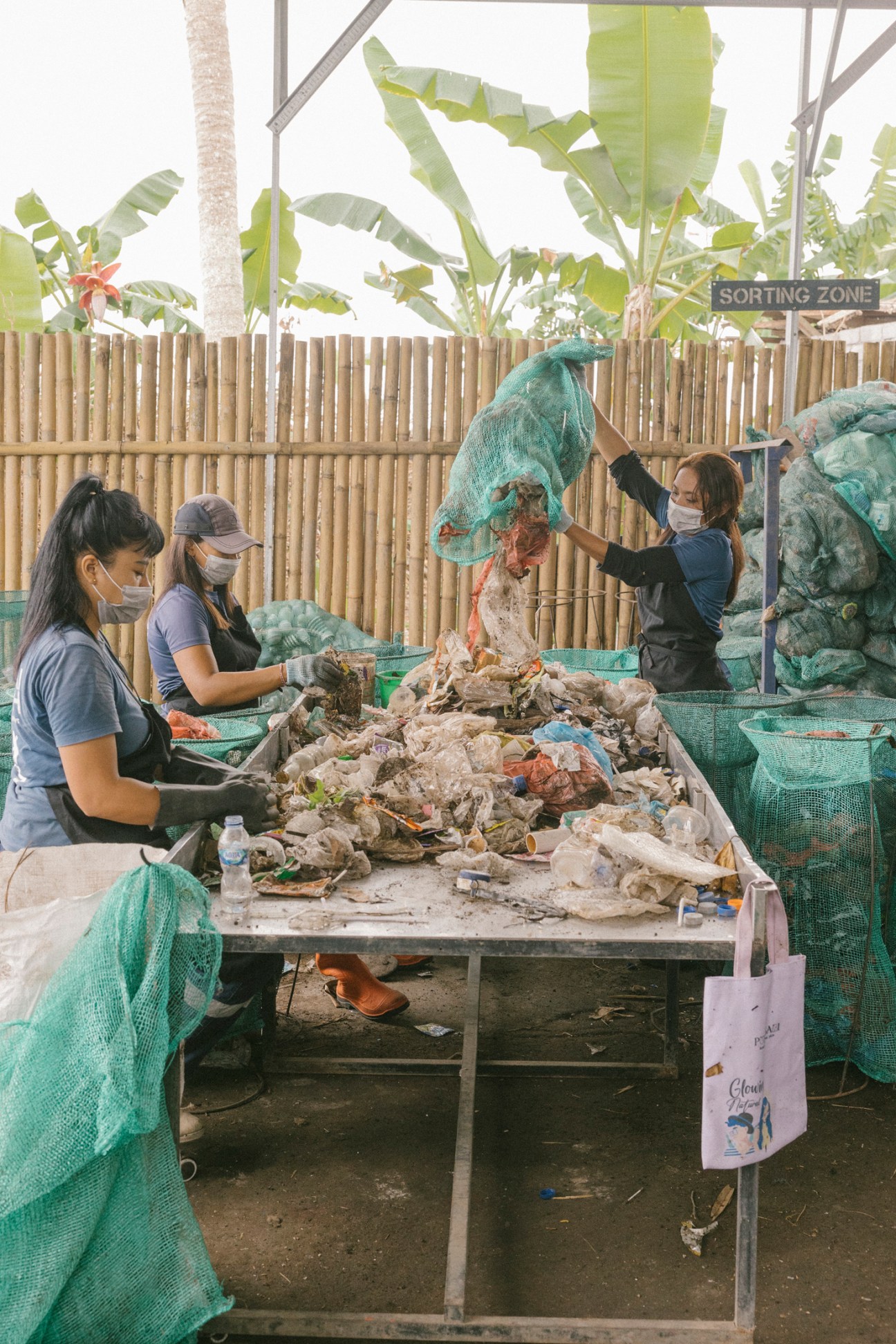 Workers sorting through collected plastic waste at Sungai Watch facility