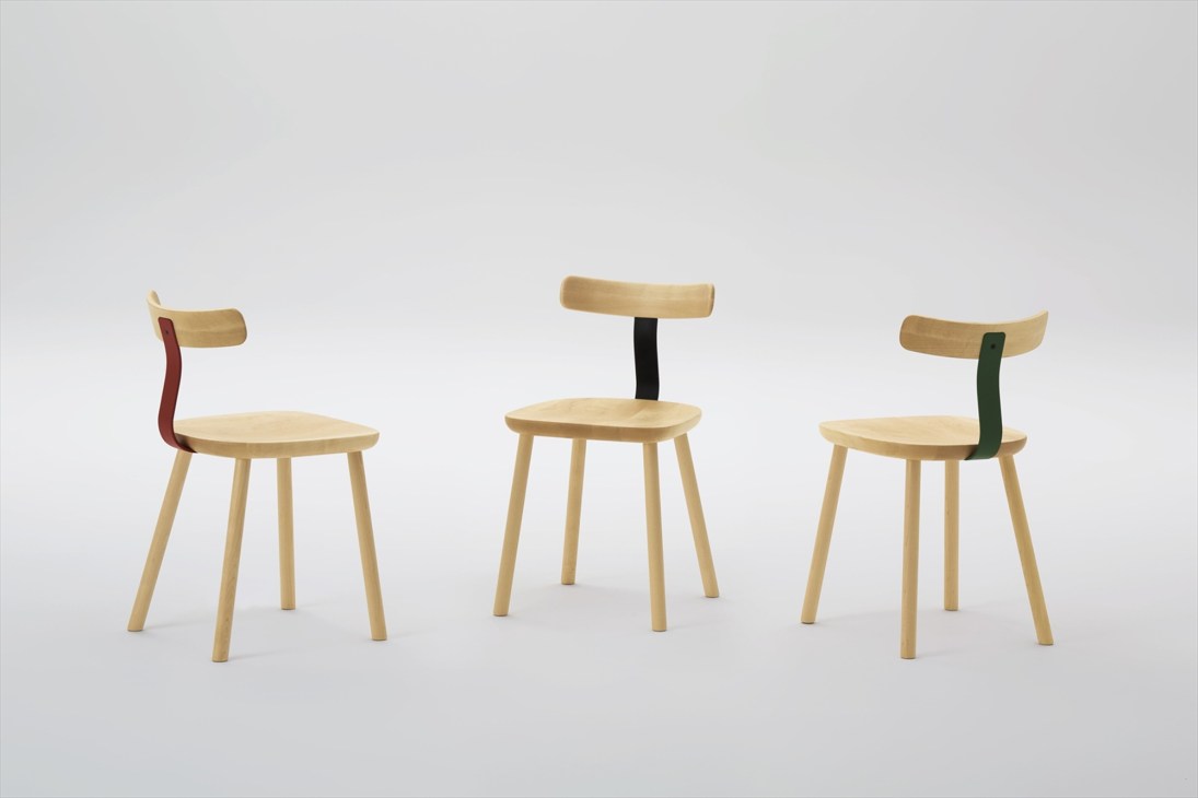 Three wooden T1 chairs by Maruni with natural wood seats and colored steel connector pieces