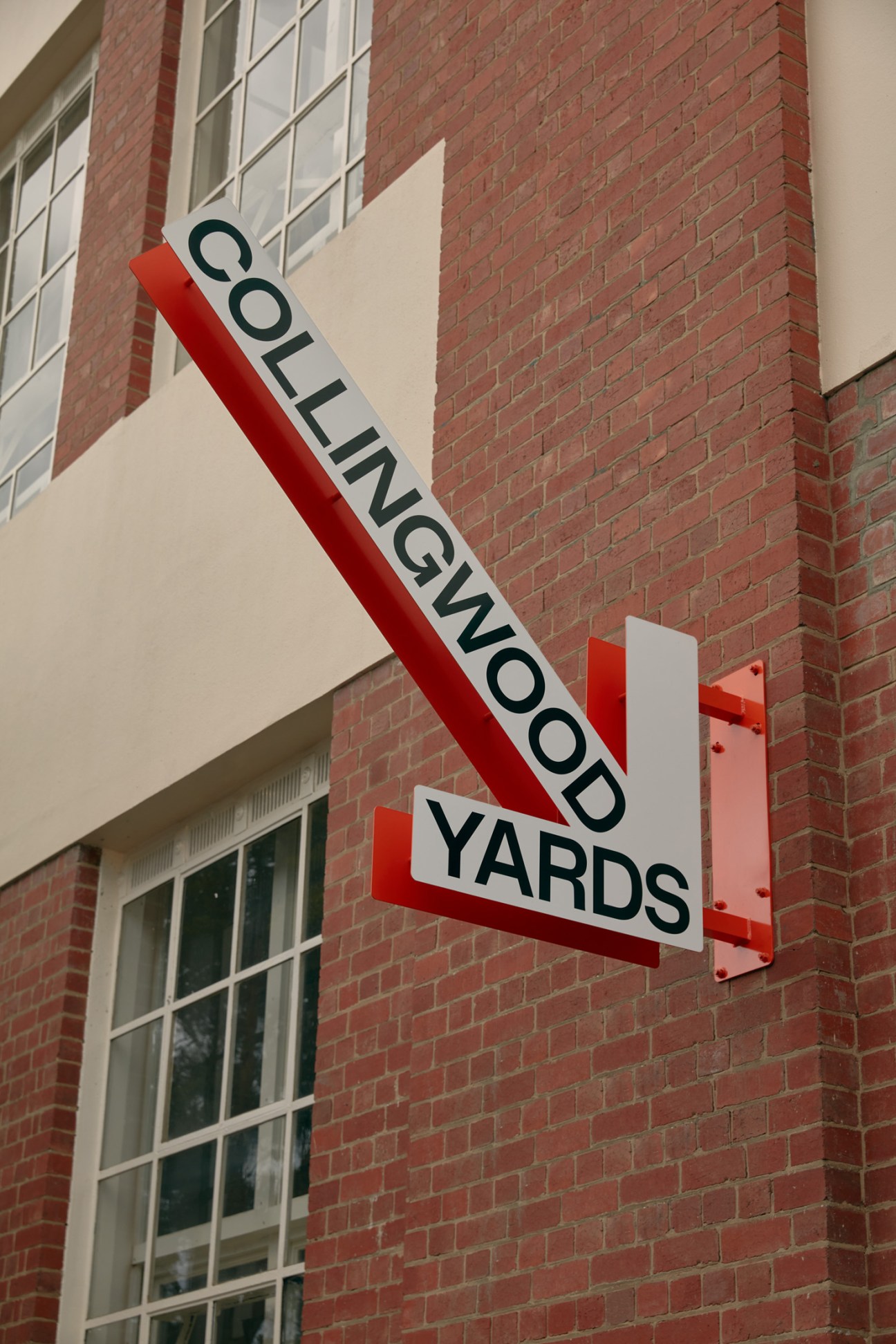Collingwood Yards wayfinding system showing the modular screw-on nameplates and signage design