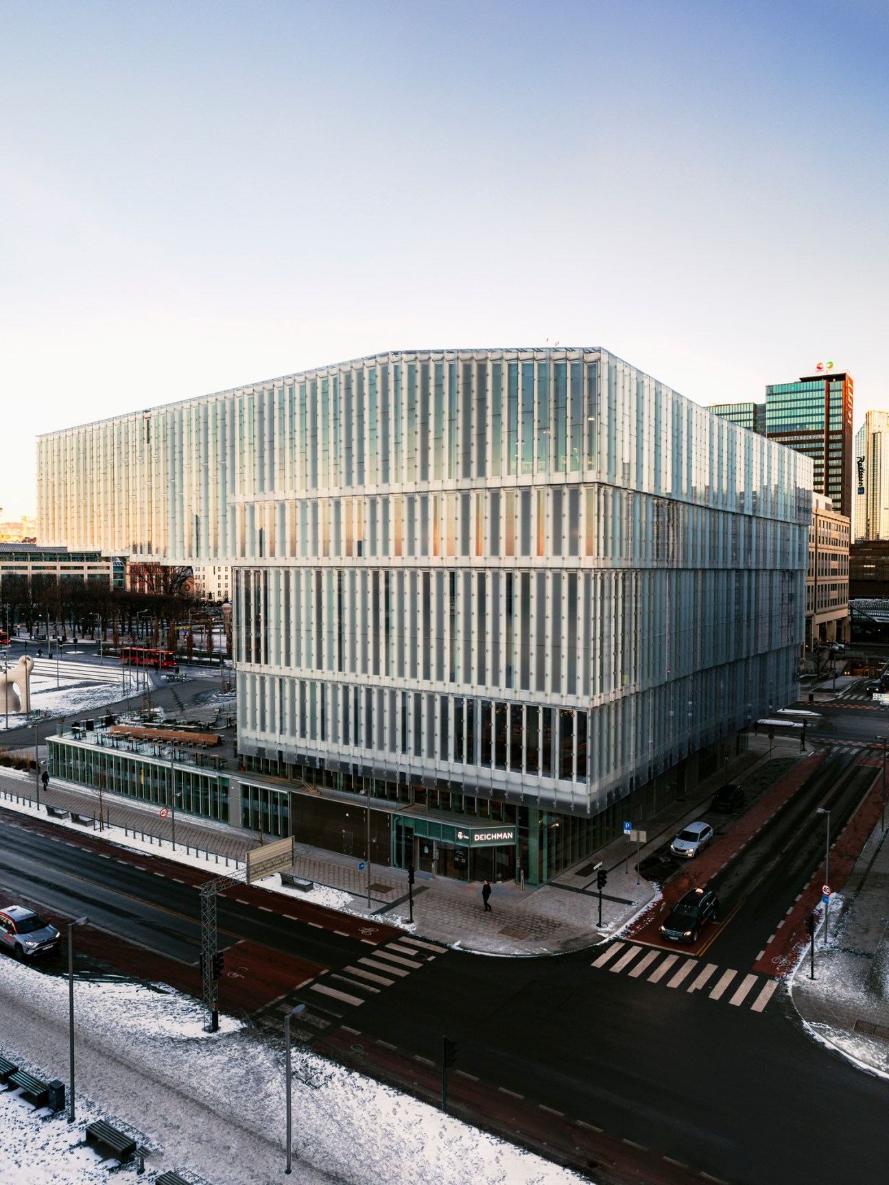 Interior view of Deichman Bjørvika library showing modern bookshelves and reading areas with natural lighting