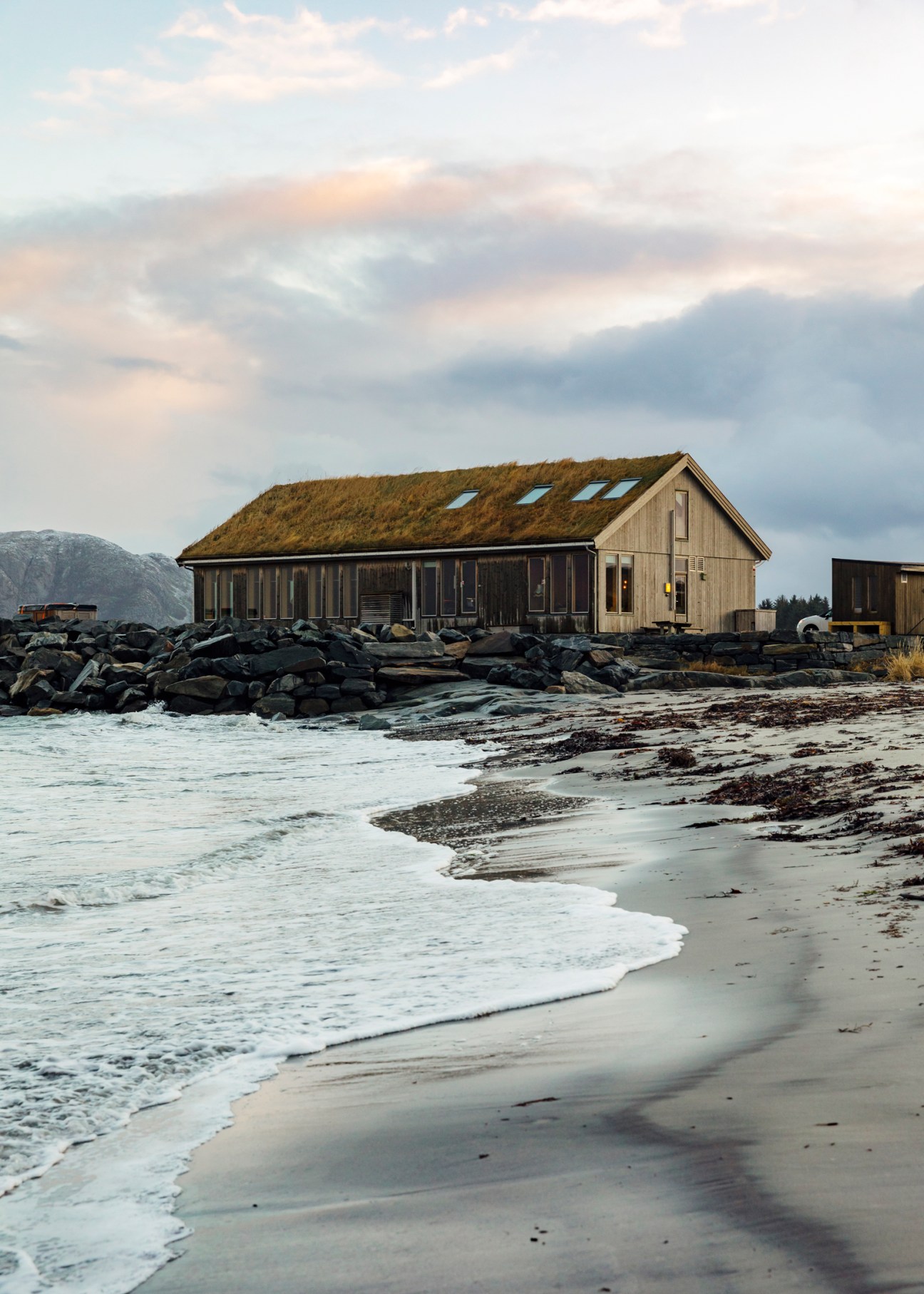Ocean Sound recording studio with grass roof on rocky coastline overlooking Atlantic Ocean in Giske, Norway