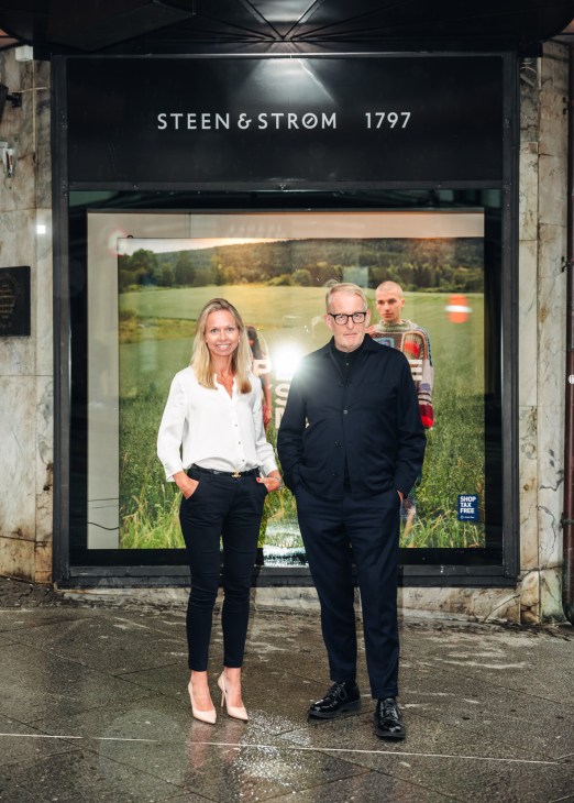 Annette Lund and David Wilkinson standing together in professional business attire