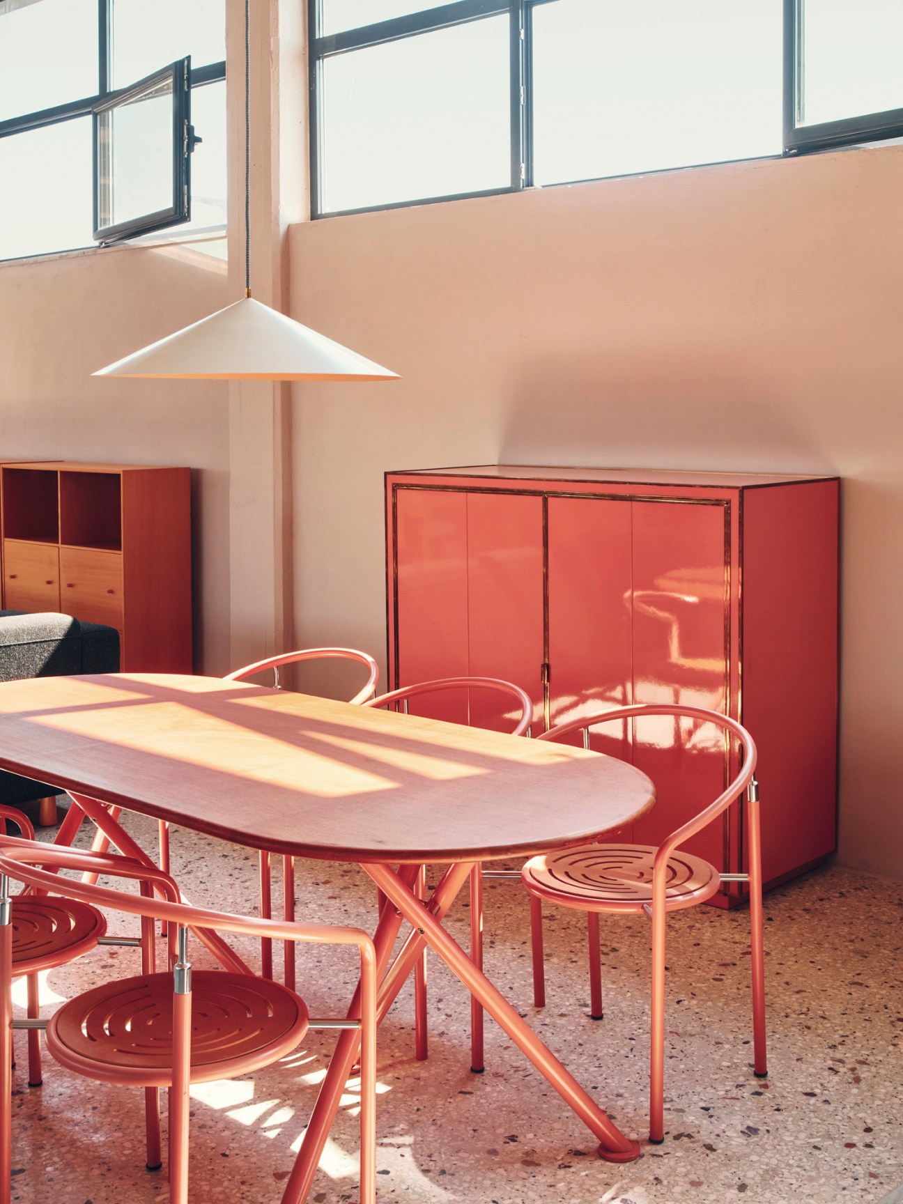 Red dining table and chairs by Rud Thygesen and Johnny Sørensen with red cabinet in modernist interior