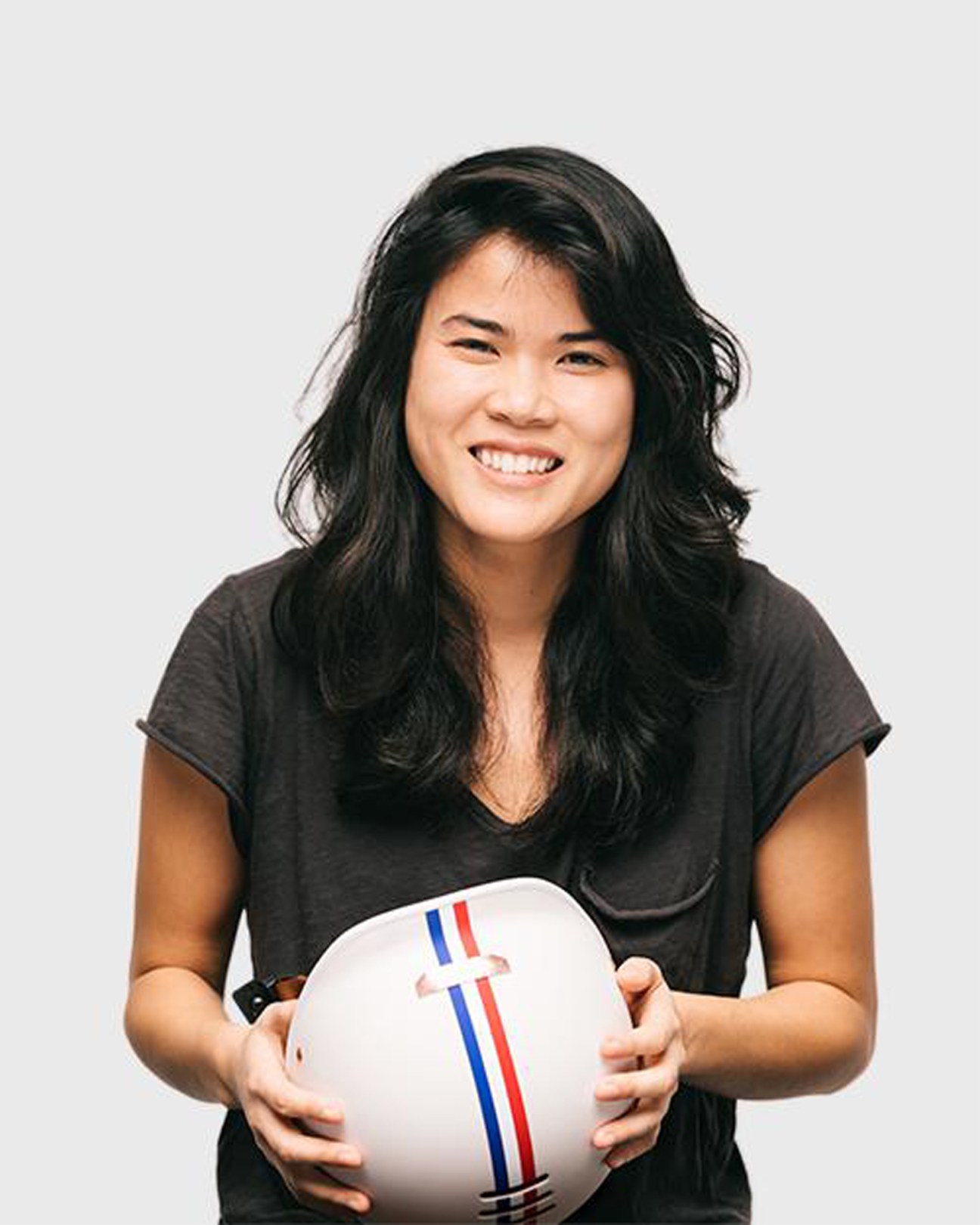 Gloria Hwang, co-founder of Thousand helmet brand, smiling at camera in portrait photo